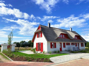 Haus zwischen Mühle und Meer